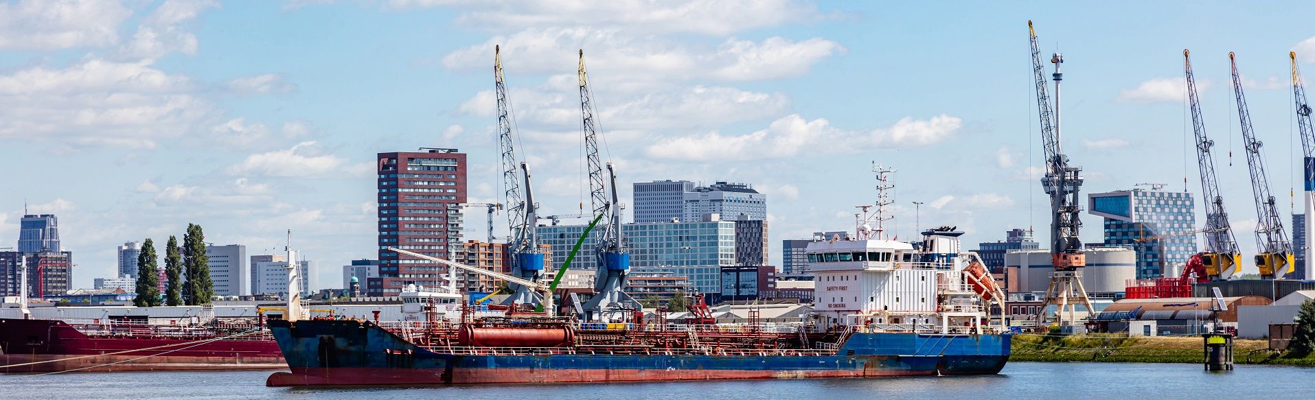 Logistics,Business.,Huge,Cranes,And,Ships,Anchored,At,Harbor.,International